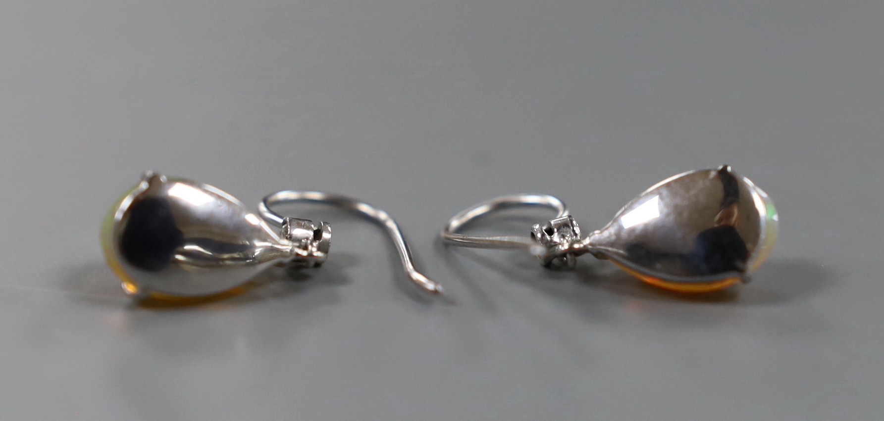 A pair of white metal, opal and diamond set earrings, overall 25mm, gross weight 2.6 grams.